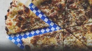 pizza with a slice removed from Pizza Face in Calgary